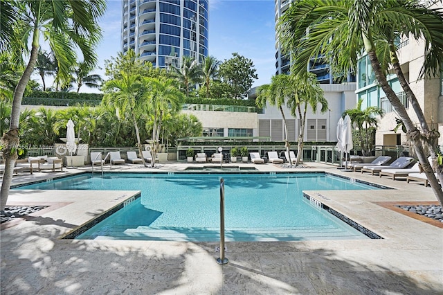 3400 SW 27th Ave Unit 1506, Miami, FL 33133 - community pool featuring a patio and fence