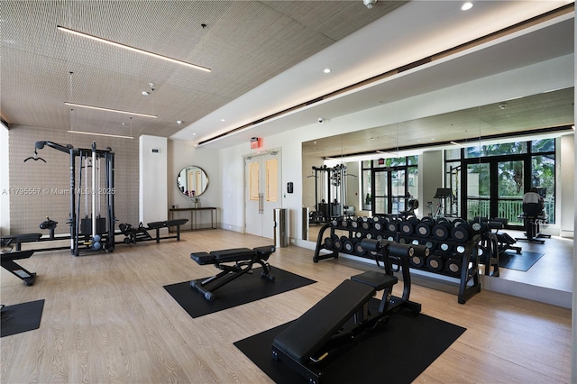 3400 SW 27th Ave Unit 1506, Miami, FL 33133 - workout area featuring french doors, recessed lighting, and wood finished floors