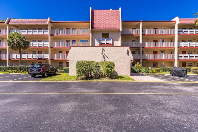 1005 Country Club Dr Unit 307, Margate, FL 33063 - view of building exterior with uncovered parking