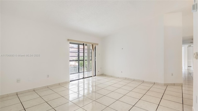 unfurnished room with visible vents and light tile patterned flooring