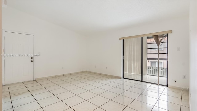 20680 NE 4th Ct Unit 206, Miami, FL 33179 - empty room with light tile patterned floors