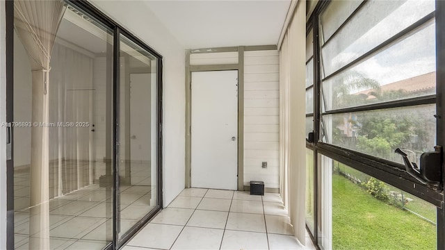 20680 NE 4th Ct Unit 206, Miami, FL 33179 - hall with light tile patterned floors and a healthy amount of sunlight