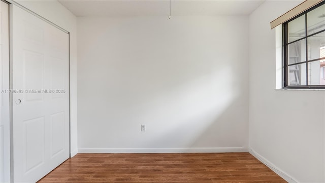 20680 NE 4th Ct Unit 206, Miami, FL 33179 - interior space featuring baseboards and wood finished floors
