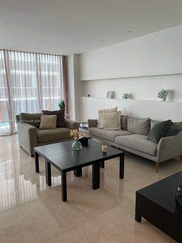 living area featuring light tile patterned flooring