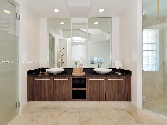 full bath featuring a sink, a stall shower, and recessed lighting