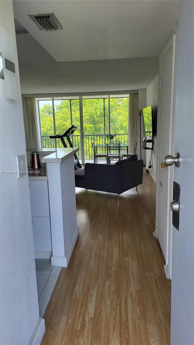 3401 N Country Club Dr Unit 410, Aventura, FL 33180 - hall featuring visible vents and wood finished floors