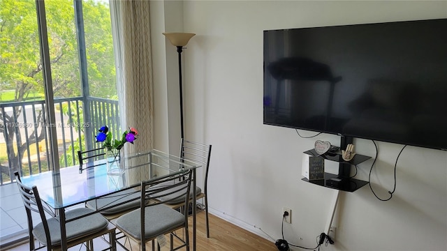 3401 N Country Club Dr Unit 410, Aventura, FL 33180 - dining space featuring baseboards and wood finished floors
