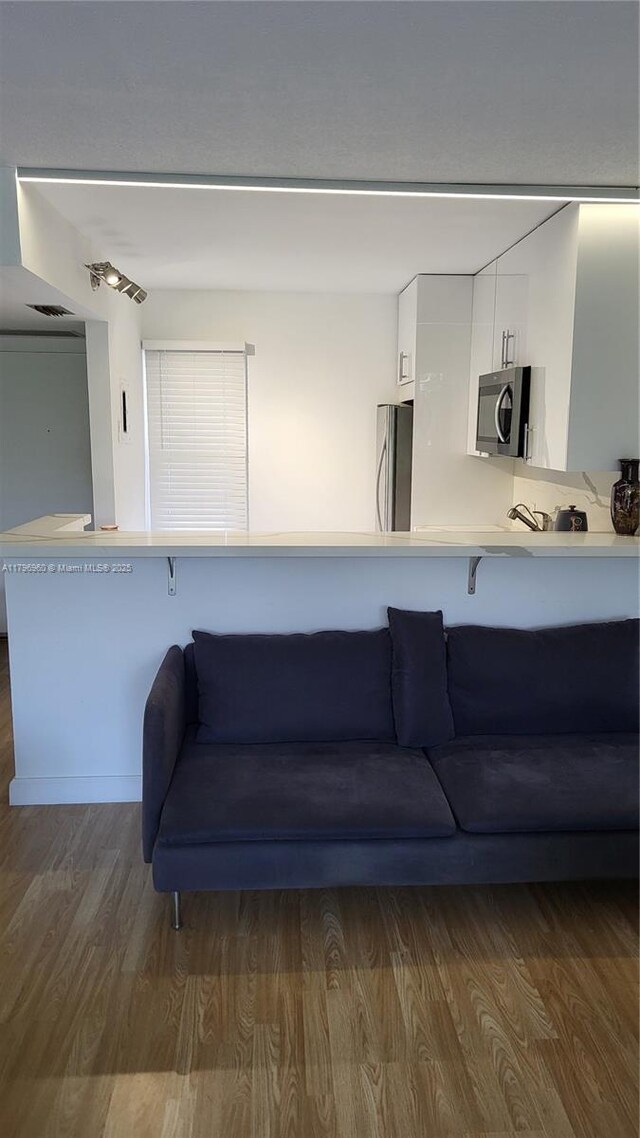 3401 N Country Club Dr Unit 410, Aventura, FL 33180 - living room with dark wood finished floors