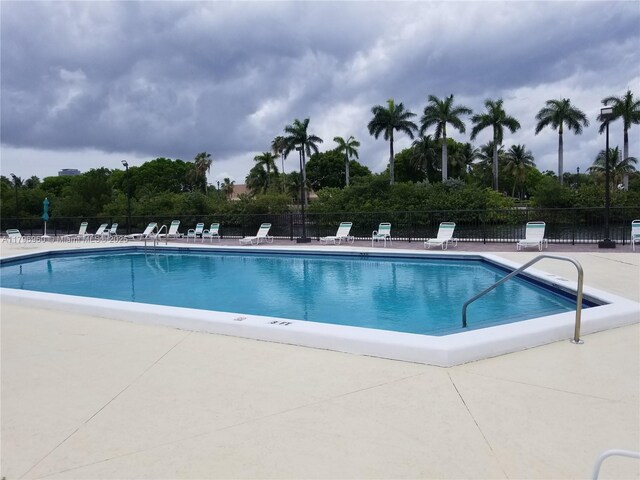 3401 N Country Club Dr Unit 410, Aventura, FL 33180 - community pool featuring a patio area and fence