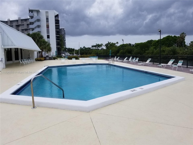 3401 N Country Club Dr Unit 410, Aventura, FL 33180 - community pool with a patio area and fence