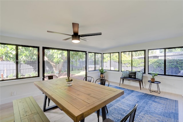 sunroom featuring baseboards