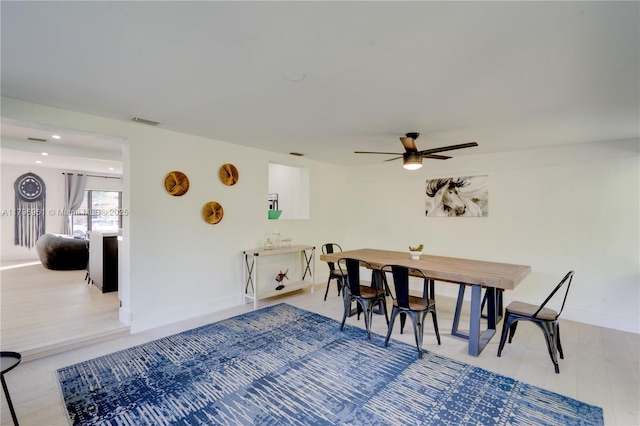dining space with a ceiling fan, recessed lighting, baseboards, visible vents, and light wood-style floors