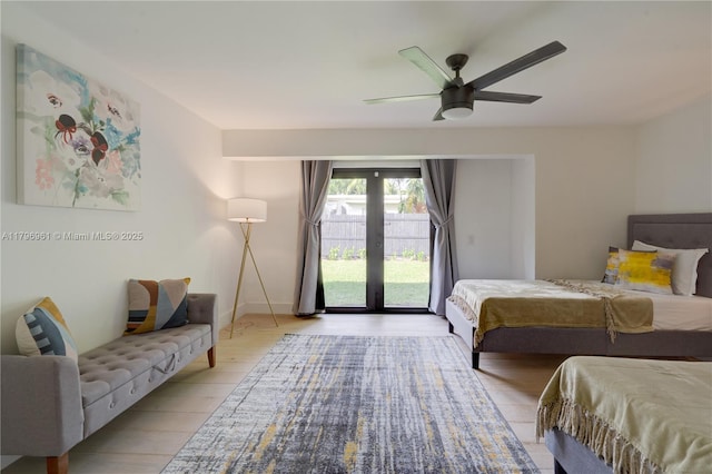 bedroom with french doors, access to exterior, ceiling fan, baseboards, and light wood-style floors