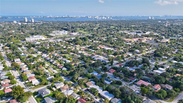 aerial view featuring a water view and a view of city