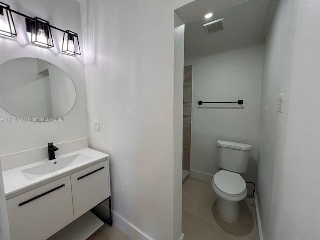 bathroom featuring baseboards, toilet, visible vents, tiled shower, and tile patterned floors
