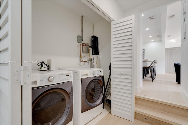 laundry room with recessed lighting, laundry area, visible vents, and washing machine and clothes dryer