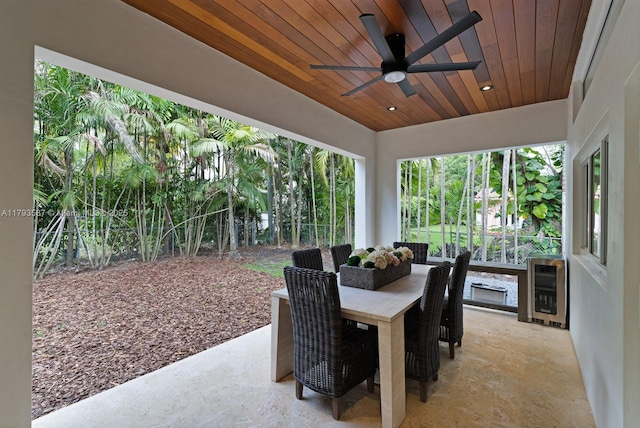 view of patio / terrace featuring a ceiling fan, outdoor dining area, and heating unit