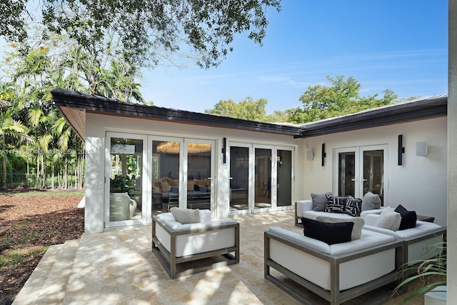 view of patio with an outdoor living space and french doors
