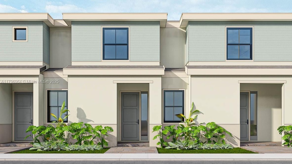 townhome / multi-family property with stucco siding