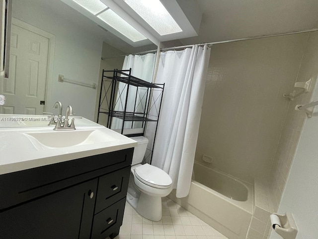 bathroom featuring tile patterned floors, toilet, shower / tub combo, and vanity