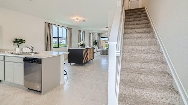 staircase featuring tile patterned flooring