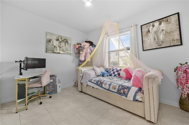 tiled bedroom with baseboards