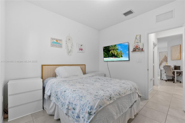 bedroom with light tile patterned floors and visible vents