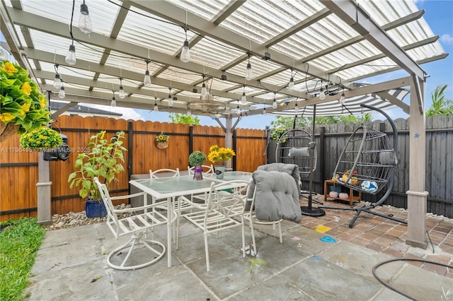 view of patio with outdoor dining area, a pergola, and a fenced backyard
