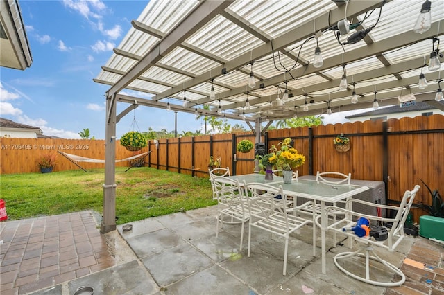 view of patio featuring a pergola, a fenced backyard, and outdoor dining area