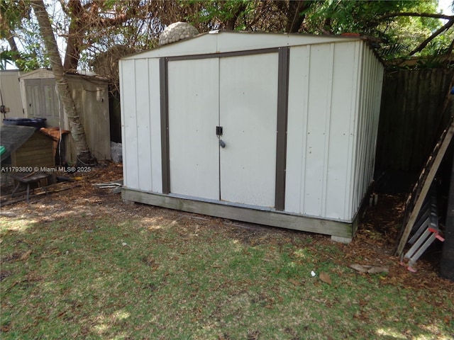 view of shed with fence
