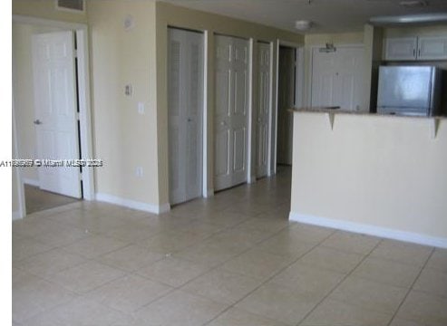 215 SW 42nd Ave Unit 905, Miami, FL 33134 - spare room with baseboards