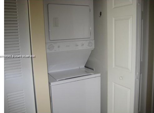 215 SW 42nd Ave Unit 905, Miami, FL 33134 - laundry room with stacked washer / drying machine