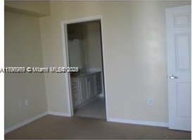 215 SW 42nd Ave Unit 905, Miami, FL 33134 - unfurnished bedroom featuring baseboards