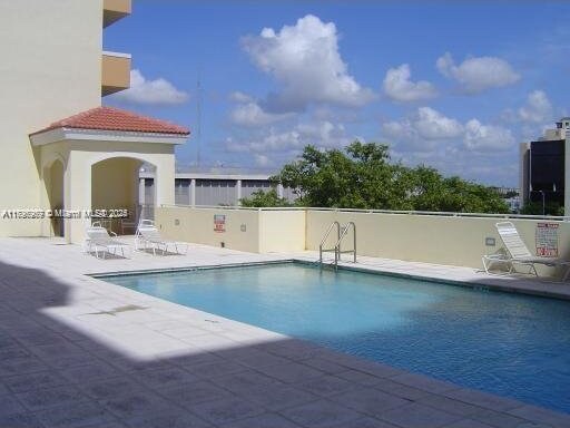 215 SW 42nd Ave Unit 905, Miami, FL 33134 - community pool with a patio