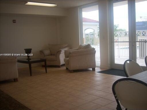 215 SW 42nd Ave Unit 905, Miami, FL 33134 - living room with light tile patterned floors