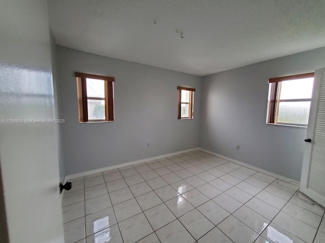 8280 Sunrise Lakes Blvd Unit 301, Sunrise, FL 33322 - spare room with light tile patterned floors and baseboards