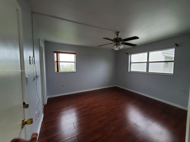8280 Sunrise Lakes Blvd Unit 301, Sunrise, FL 33322 - unfurnished room featuring dark wood finished floors, a wealth of natural light, and baseboards