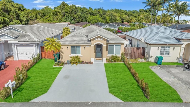 view of front of home featuring a front yard, stucco siding, a tile roof, and fence