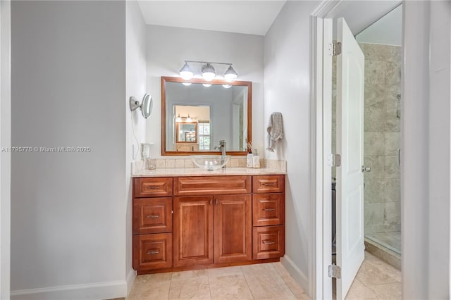 full bath featuring a shower stall, baseboards, tile patterned floors, and vanity
