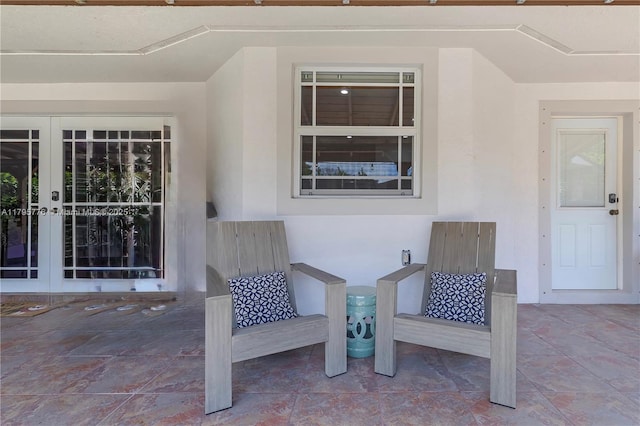 entrance to property with stucco siding and french doors