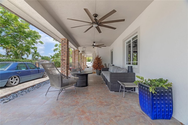 view of patio with a ceiling fan and outdoor lounge area