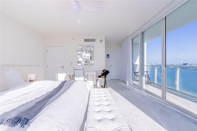 bedroom with a wall of windows, a ceiling fan, and visible vents
