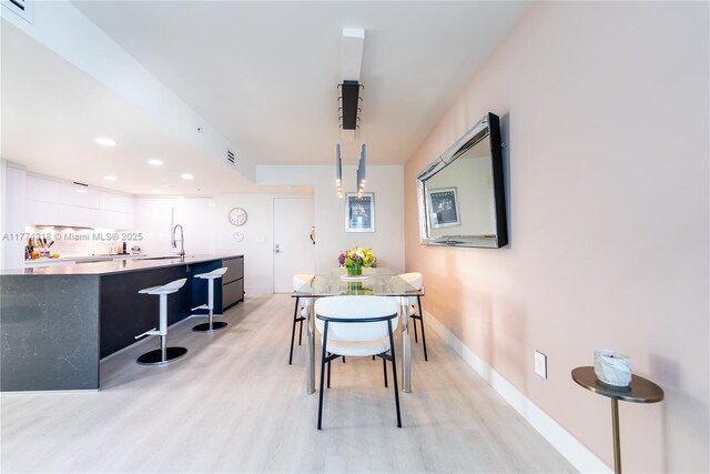 665 NE 25th St Unit 2301, Miami, FL 33137 - dining room featuring light wood finished floors and recessed lighting