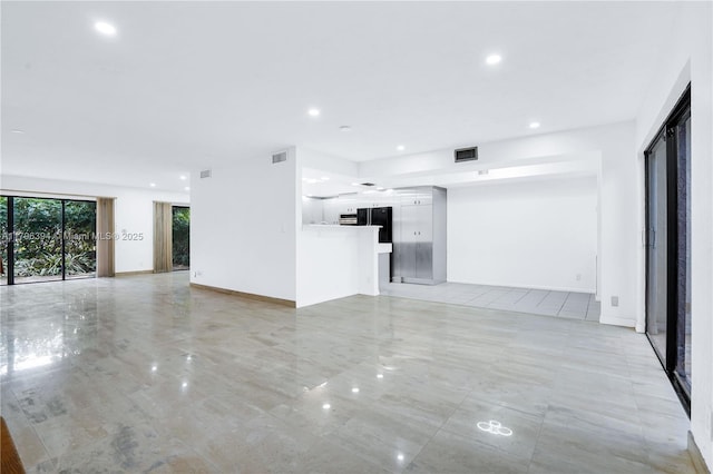 406 Saint Andrews Rd Unit 53, Hollywood, FL 33021 - unfurnished living room with baseboards, visible vents, and recessed lighting