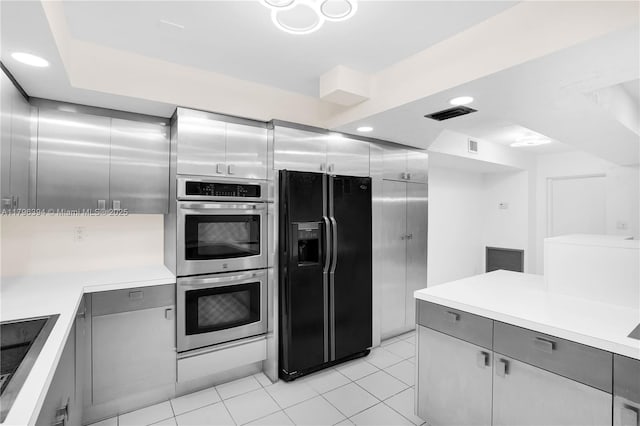 406 Saint Andrews Rd Unit 53, Hollywood, FL 33021 - kitchen with light countertops, black appliances, gray cabinets, and visible vents