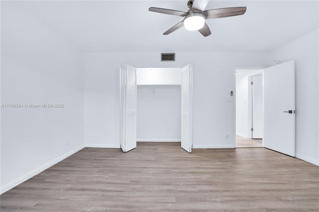 406 Saint Andrews Rd Unit 53, Hollywood, FL 33021 - unfurnished bedroom with baseboards, light wood-type flooring, visible vents, and a closet