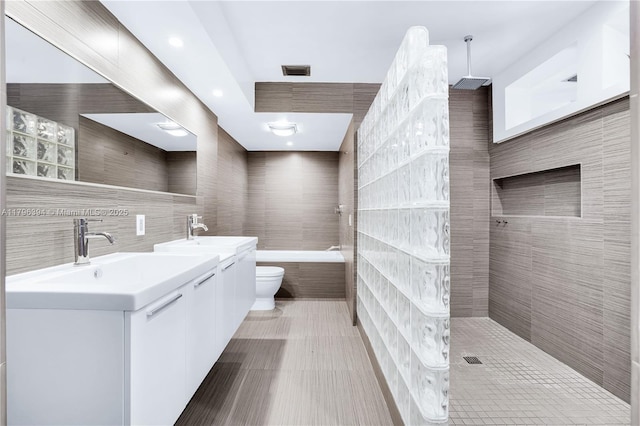 406 Saint Andrews Rd Unit 53, Hollywood, FL 33021 - bathroom with tile walls, visible vents, a sink, and a walk in shower