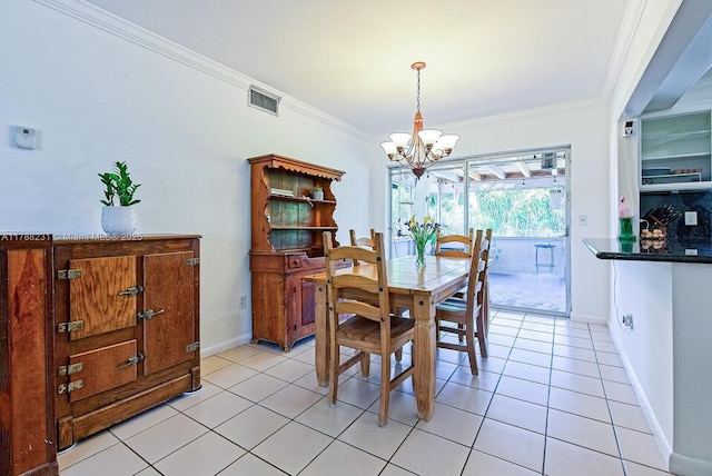 dining space with crown molding, visible vents, baseboards, a chandelier, and light tile patterned flooring