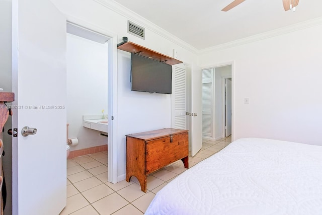 bedroom featuring crown molding, light tile patterned flooring, ceiling fan, and visible vents