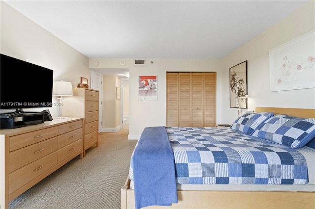 bedroom featuring light carpet, a closet, baseboards, and visible vents